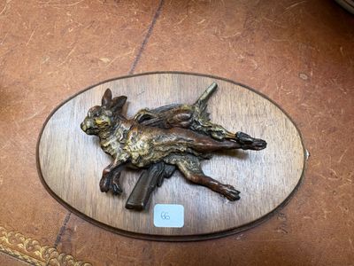 a bronze statue of a man on a horse on a table