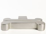 a close up of a metal object on a white surface