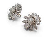 a pair of diamond and white gold earrings