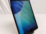a tablet that is sitting on a stand on a table