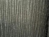 a close up of a toilet with a wooden seat
