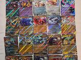 a pile of pokemon cards sitting on top of a table