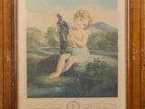 an old picture of a baby sitting on a rock with a bird in its hand