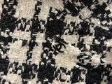 a close up of a black and white piece of cloth