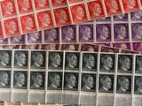 a close up of a pile of stamps on a table