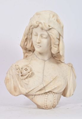 a statue of a woman holding a flower in her hand