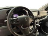 dashboard view of a car with a steering wheel and dashboard controls