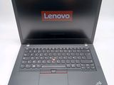 a laptop that has a lenovo logo on the screen