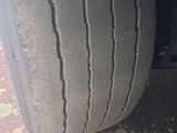 the tire of a truck with a flat tire on the ground
