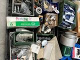 boxes of assorted items are stacked on a shelf in a garage