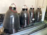 four large black tanks sitting on a table