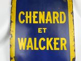 a close up of a sign on a white surface with a blue background