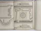 an open book with a drawing of a building in it