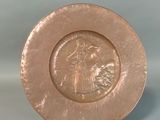 a plate that has a picture of a woman on it