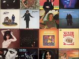 the album covers of various albums are displayed on the wall