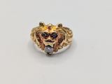 a close up of a ring with a lion head on it