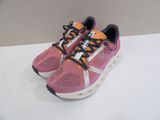 pink and orange nike air max running shoes on a white surface