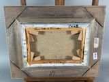 an old picture frame with a picture in it on a wooden easel