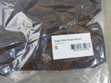a brown and black leopard print shirt with a tag on it