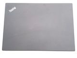the mouse pad is gray and has a white sticker on it