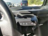 a car dashboard with a steering wheel and a dash button