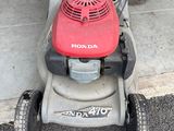a small lawn mower that is sitting on the ground