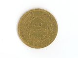 an image of a gold coin sitting on top of a white surface