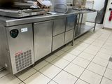 a large stainless steel counter in a commercial kitchen