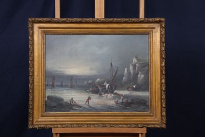 tableau sur chevalet représentant des personnes sur une plage