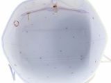 the inside of a white purse with stars on it