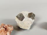 three different types of rocks and crystals on a white surface