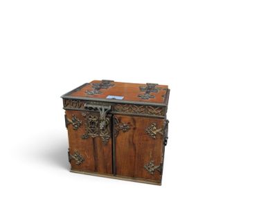 a small wooden chest with ornate carvings on it