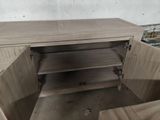 a wooden cabinet that has a drawer in it