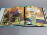 an open book with a picture of a woman in a kitchen