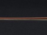 an image of a wooden and metal pipe on a black background