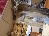 a box with a bunch of religious items inside of it