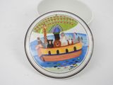 a plate with a picture of a boat with animals on it