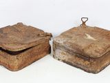 pair of antique wooden boxes with metal handles on a white surface