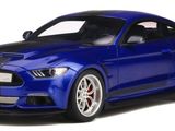 the blue mustang is parked on a white surface
