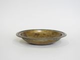 an image of a small bowl sitting on top of a white surface
