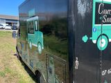 an image of a delivery truck parked on the side of the road
