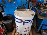 an image of a large white barrel in a garage