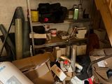 a pile of boxes and other items in a garage