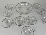 a lot of glass dishes on a white table