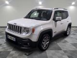 the white jeep is parked on a checkered floor in the garage