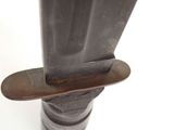 a close up of a knife on a metal pole