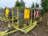 a yellow trailer with a yellow sign on the back of it