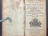 a book with a key in it sitting on a table