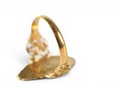 a gold ring with a diamond on it