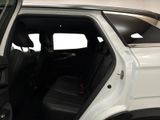 the interior of a white truck with the door open and the passenger seat down